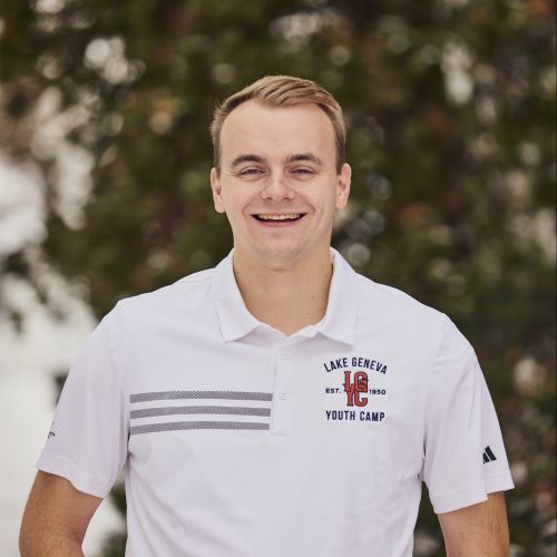 White male in a white polo
