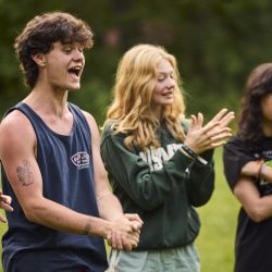 group of young adults cheering