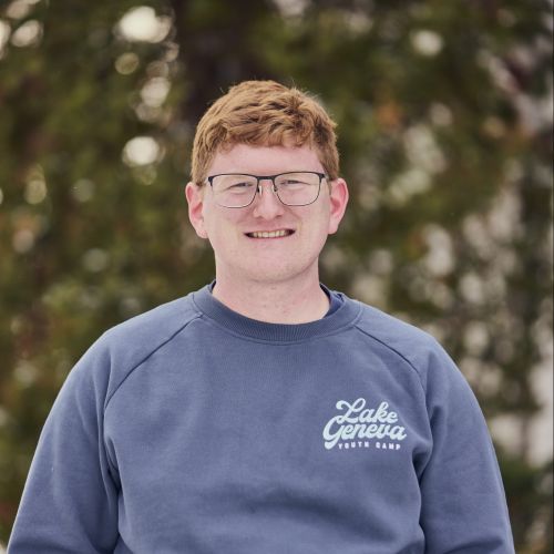 white male with glasses smiling