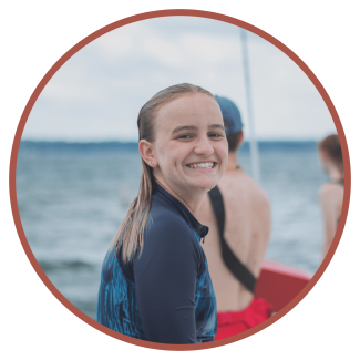 Girl Smiling at lake while at summer camp in Lake Geneva Wisconsin